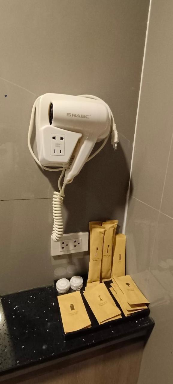 The Airport Courtyard Suvarnabhumi Airport Бангкок Екстер'єр фото A hair dryer in a hotel bathroom